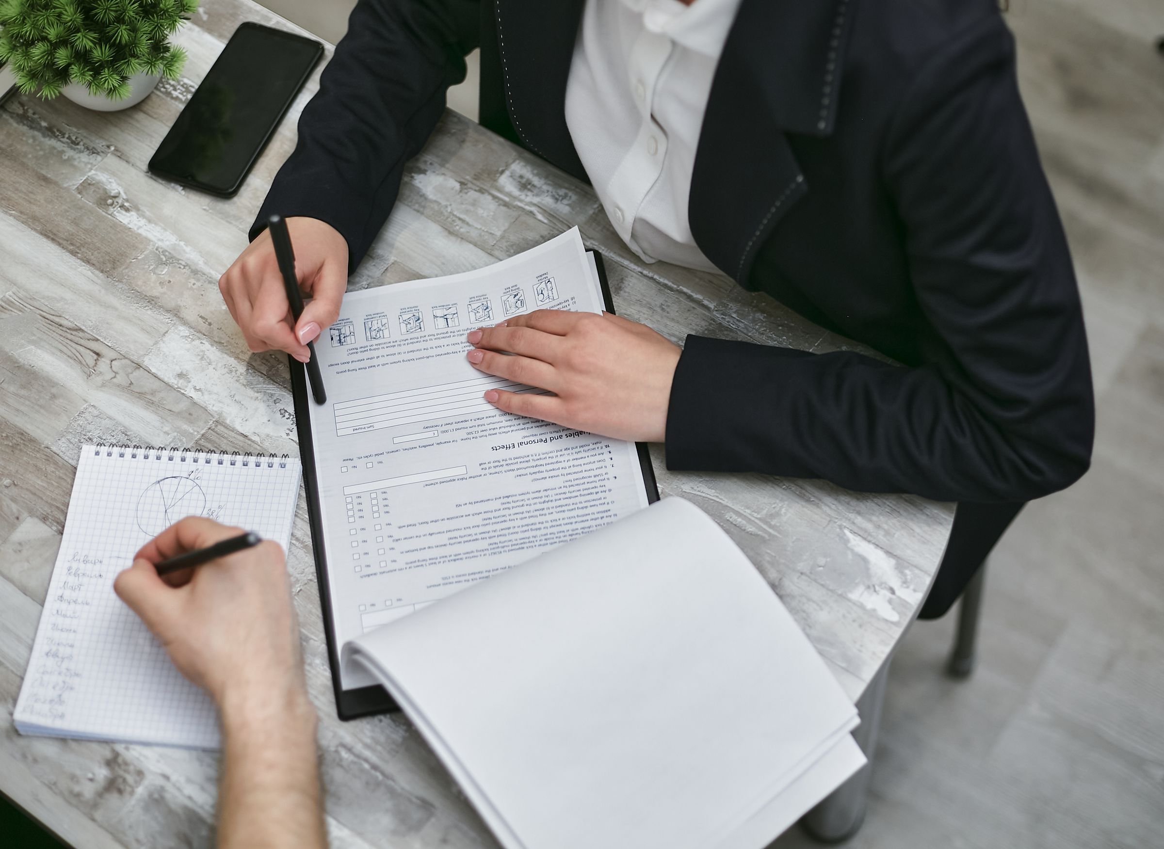 Documents being reviewed and organised during a business consultation